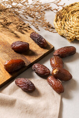 Fresh Medjool Dates on Wooden Board and Linen Cloth