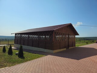 A wooden building with a fence around it