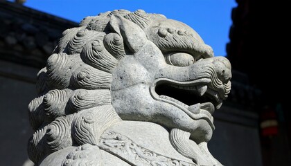Obraz premium Close-up of a stone guardian lion statue.