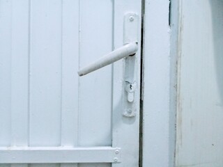 White Door With a Simple Handle and Keyhole Design