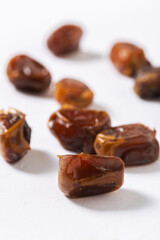Close-Up of Chopped Fresh Dates on White Background