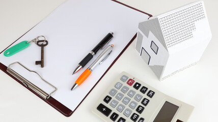 Architectural design table with model of a single-family house.