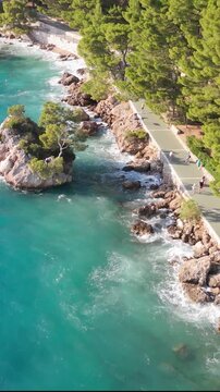 Vertical Drone Footage of Punta Rata Beach and Brela Stone During Summer Bura Wind