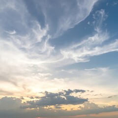 Obraz premium A vibrant blue sky stretches overhead, dotted with fluffy white clouds, creating a serene and uplifting atmosphere that invites relaxation and wonder.