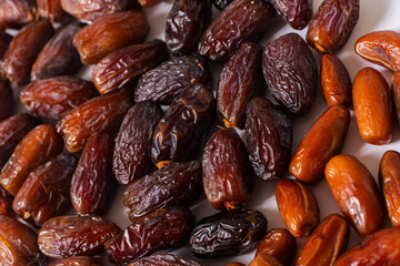 Assorted Fresh Dates Close-Up on White Background