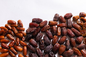 Assorted Varieties of Dates on White Background