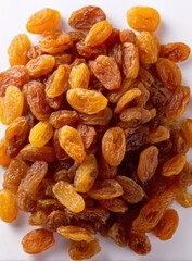 Close-up shot of a pile of golden raisins, showcasing their wrinkled texture and rich color, perfect for illustrating healthy snacks or culinary ingredients.