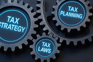 Tax strategy, tax planning, and tax laws concepts represented by interconnected metal gears with glowing blue text, symbolizing financial management and compliance