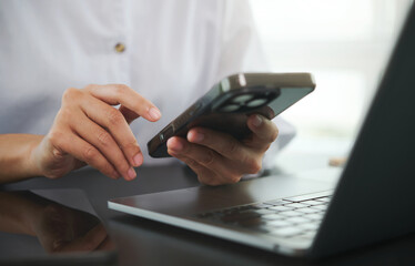 Smartphone and laptop workflow for mobile productivity online payment banking messaging and remote...