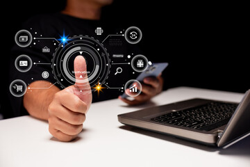 A person uses biometric technology on a laptop, symbolizing digital security and verification.