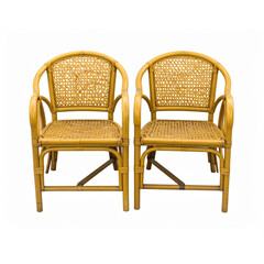 Two wooden chairs and a table on the grass