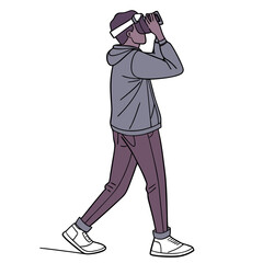 Young man wearing virtual reality headset and casual clothing walking and looking through the device