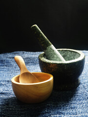 mortar and pestle on wooden table, closeup
