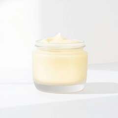 Creamy lotion jar with bright background.