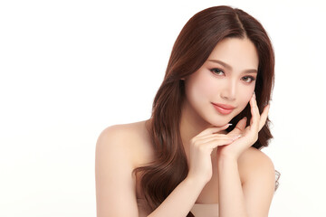 Fototapeta premium A beautiful young Asian woman with clean, fresh skin against a white background. Skincare, facial treatment, cosmetology, beauty, and spa. An elegant portrait of an Asian woman.