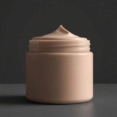 Creamy skincare jar with dark background.