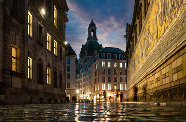Dresden, Germany. Evening view from the Dresden Frauenkirche and old porcelain artwork Procession of princes , Dresden, Germany.