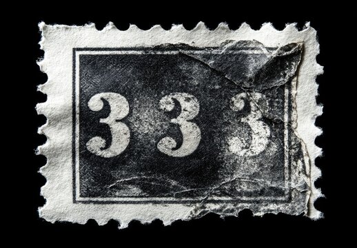 Close-up of a weathered postage stamp.  The black rectangular stamp, featuring the number "333", is slightly torn and creased.  Its surface shows signs of age 