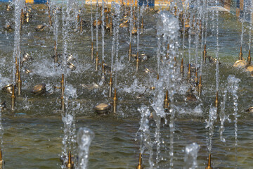 Abstract background of fountain jets, selective focus.