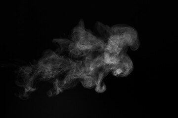 Blur white water vapour on isolated black background. Abstract of steam with copy space. Steam flow. Smoke on white background.