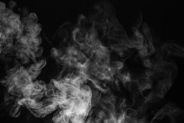 Blur white water vapour on isolated black background. Abstract of steam with copy space. Steam flow. Smoke on white background.