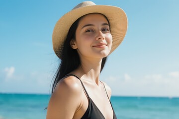 young woman with swimsuit and hat in summer
