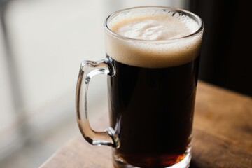 full glass of dark beer