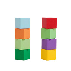Colorful wooden toy cubes stacked in two towers for childhood learning and development, isolated on a white background.