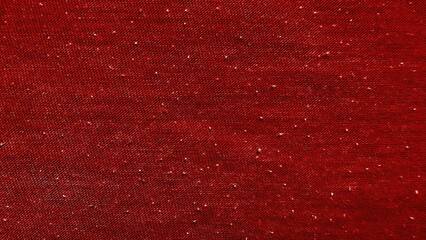 deep crimson woven fabric with scattered white flecks ideal for fashion textile backgrounds or upholstery design accents