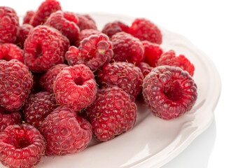 Sweet ripe raspberries isolated on white background, macro.