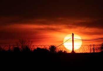  Big sun on the dark sunset © Diego