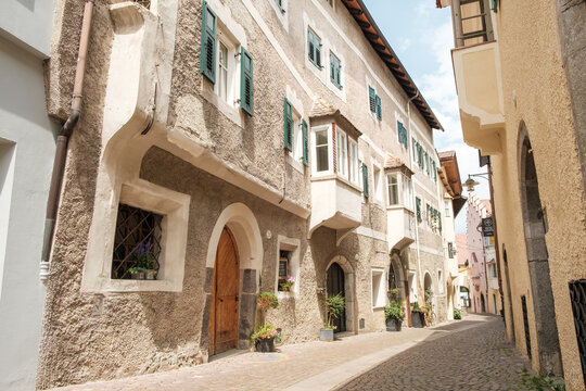 Old historical building in a tight alley of the old town of Klausen in Italy.