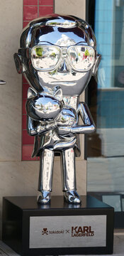 Portugal, Loul&eacute;, August 10. 2025, Chrome-colored sculpture of fashion designer Karl Lagerfeld holding his cat Choupette. Collaboration between Japanese lifestyle brand Tokidoki and Karl Lagerfeld.