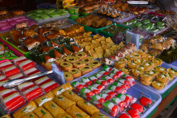 Traditional Indonesian market snacks. Delicious cakes in various colors.