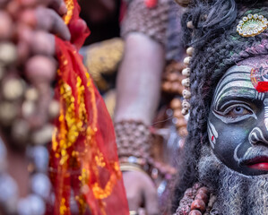 Masan Holi, Portrait of an male artist act as lord shiv with dry ash on face and body during celebrating the holi festival as tradition at Manikarnika ghat in varanasi, India