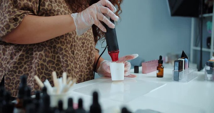 Mixing cosmetic ingredients in beauty studio