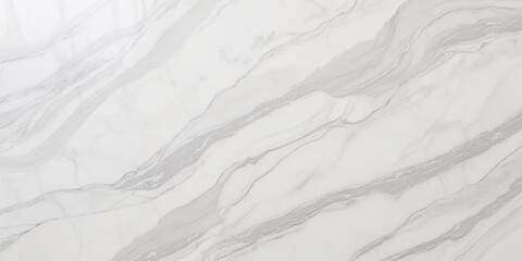 Luxury texture of light gray marble with flowing natural patterns and faint metallic highlights.	