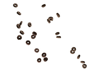 Chocolate rings cereal spill out into a bowl. Breakfast.