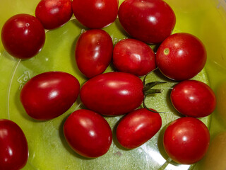 Freshly Picked Red Cherry Tomatoes on a Surface