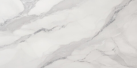 Luxury texture of light gray marble with flowing natural patterns and faint metallic highlights.	