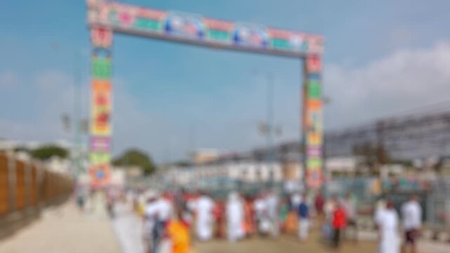 Bokeh view of devotees visit Balaji temple at Tirumala hill. The most visited place of Hindu pilgrimage. Sri Venkateswara Swamy Vaari Temple, Tirumala, Tirupati, India. Blurred background footage.