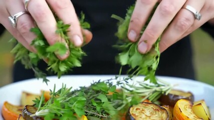 Hands gently preparing fresh vibrant parsley for a delicious culinary creation, capturing the essence of healthy eating and home cooking.