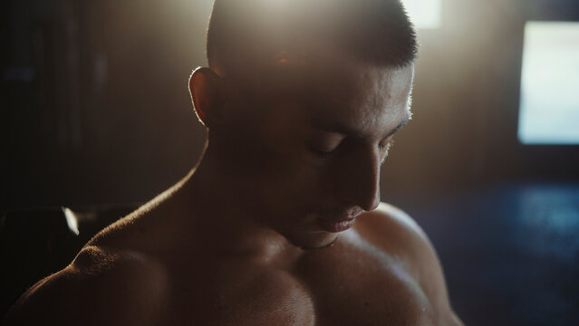 Tired boxer resting after intense training in gym - Powered by Adobe