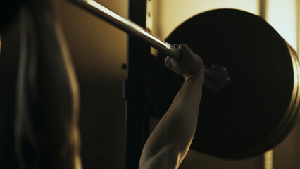 Athlete lifting weights during intense bench press workout