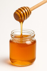 Golden honey dripping from a wooden dipper into a small glass jar isolated on transparent background