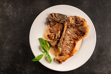 t-bone steak roast cut of meat juicy roast beef tasty snack fresh delicious gourmet food background on the table rustic food top view copy space