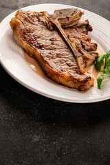 t-bone steak roast cut of meat juicy roast beef tasty snack fresh delicious gourmet food background on the table rustic food top view copy space