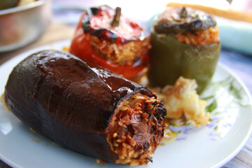 Green red peppers and eggplants stuffed with rice tomato and herbs for vegan                                                            