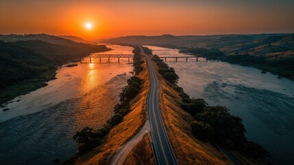 Obraz premium Drone view of BR-101 highway and bridge at dawn in Brazilian countryside