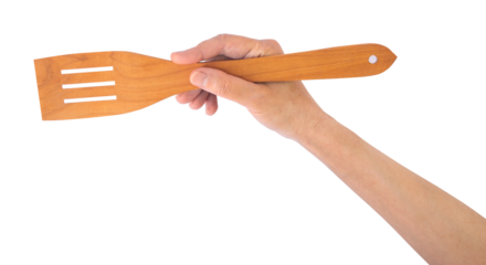 Transparent PNG of woman’s hand with wooden spatula, ideal for culinary cards, advertisements, or presentation visuals. PNG